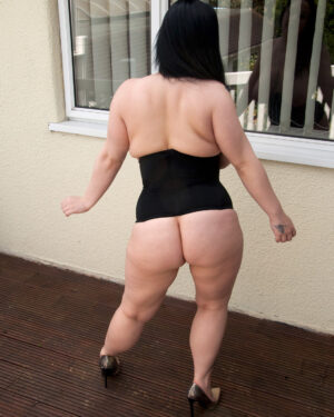 Nikkie from Busty Britain Corset Stripping