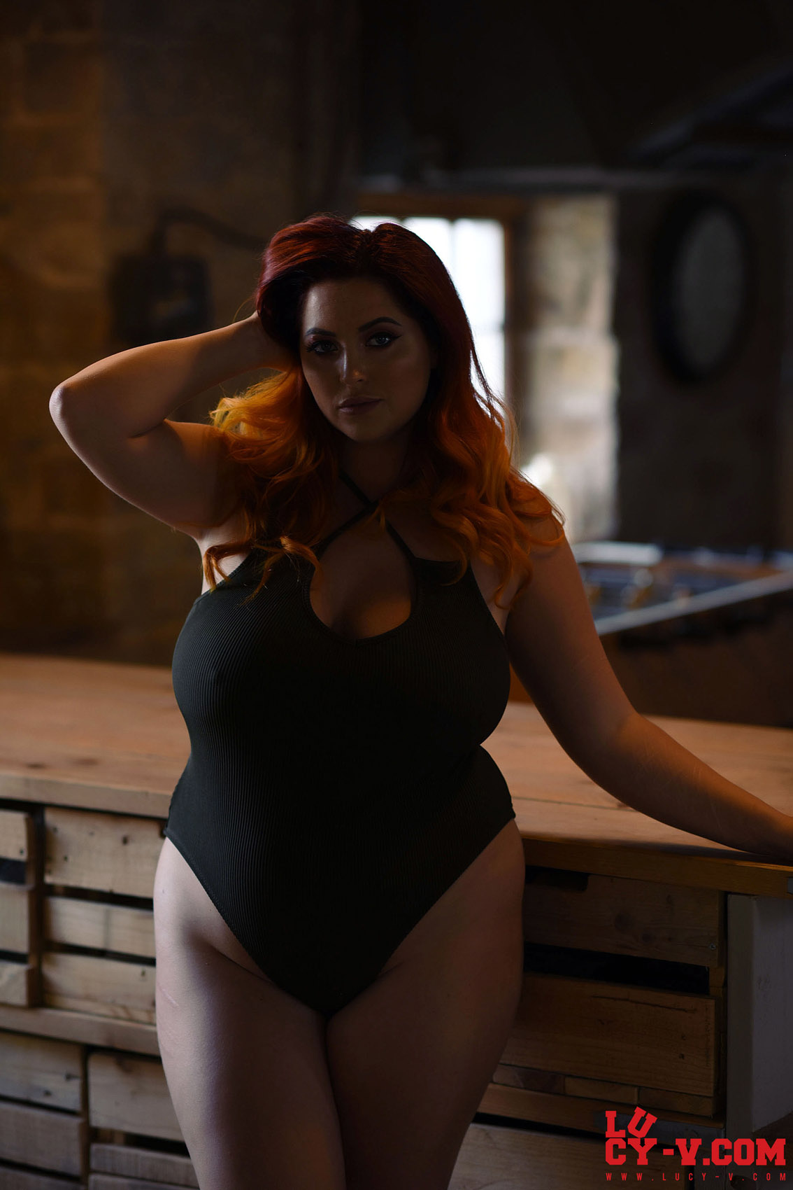 It's seductive, and her black bodysuit looks amazing on her curvy body...